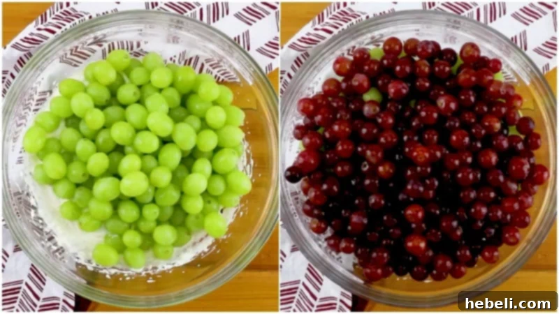 Adding fresh grapes to the creamy dressing.