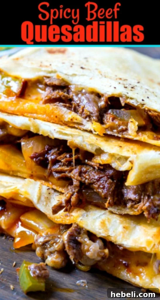 Zesty Beef Quesadillas 7 Close-up of Quesadilla slices stacked on top of each other, showcasing the rich beef and cheese filling.