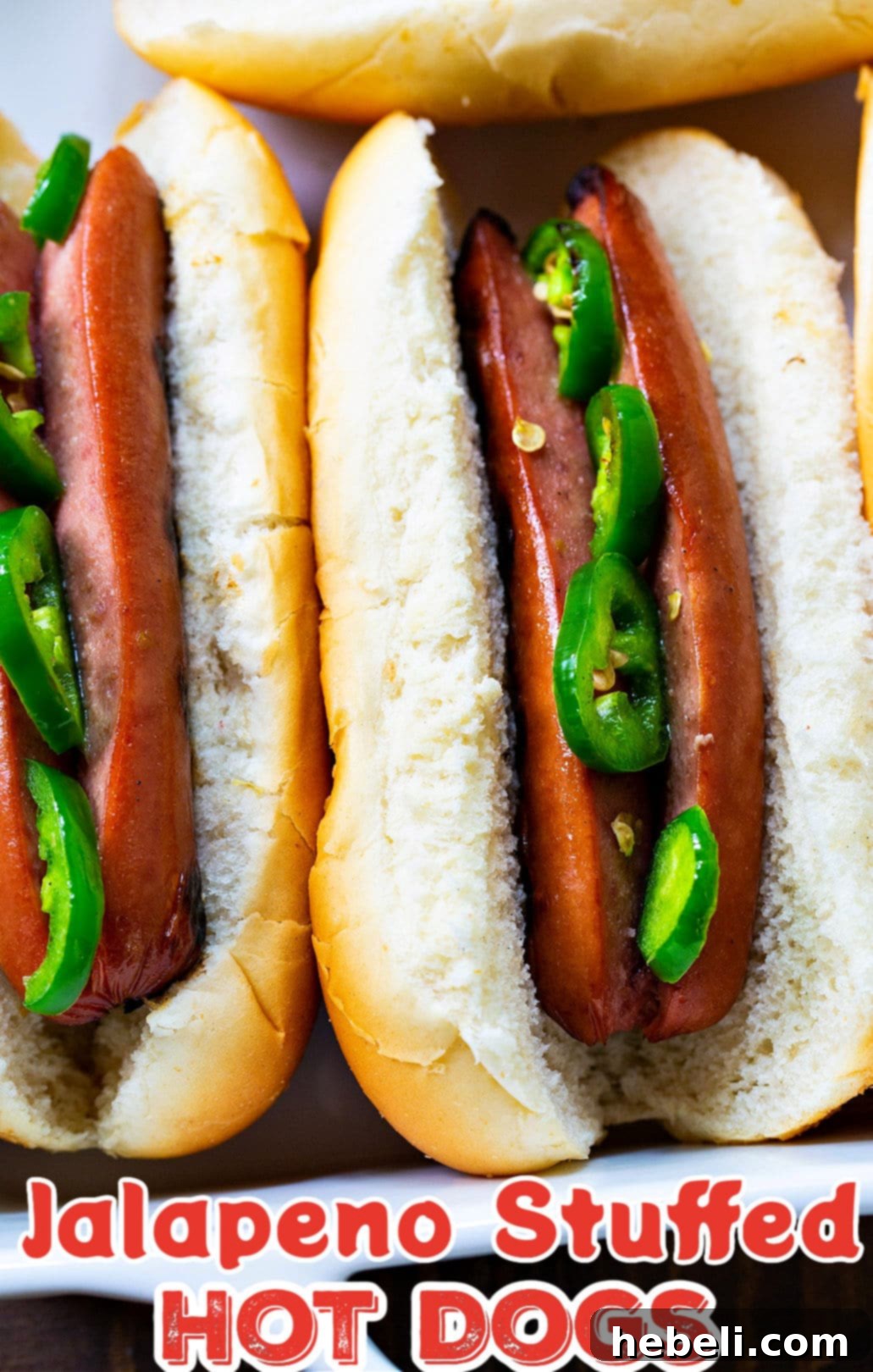 Fiery Jalapeno Franks 5 Jalapeno Stuffed Hot Dogs in buns, served with sides.