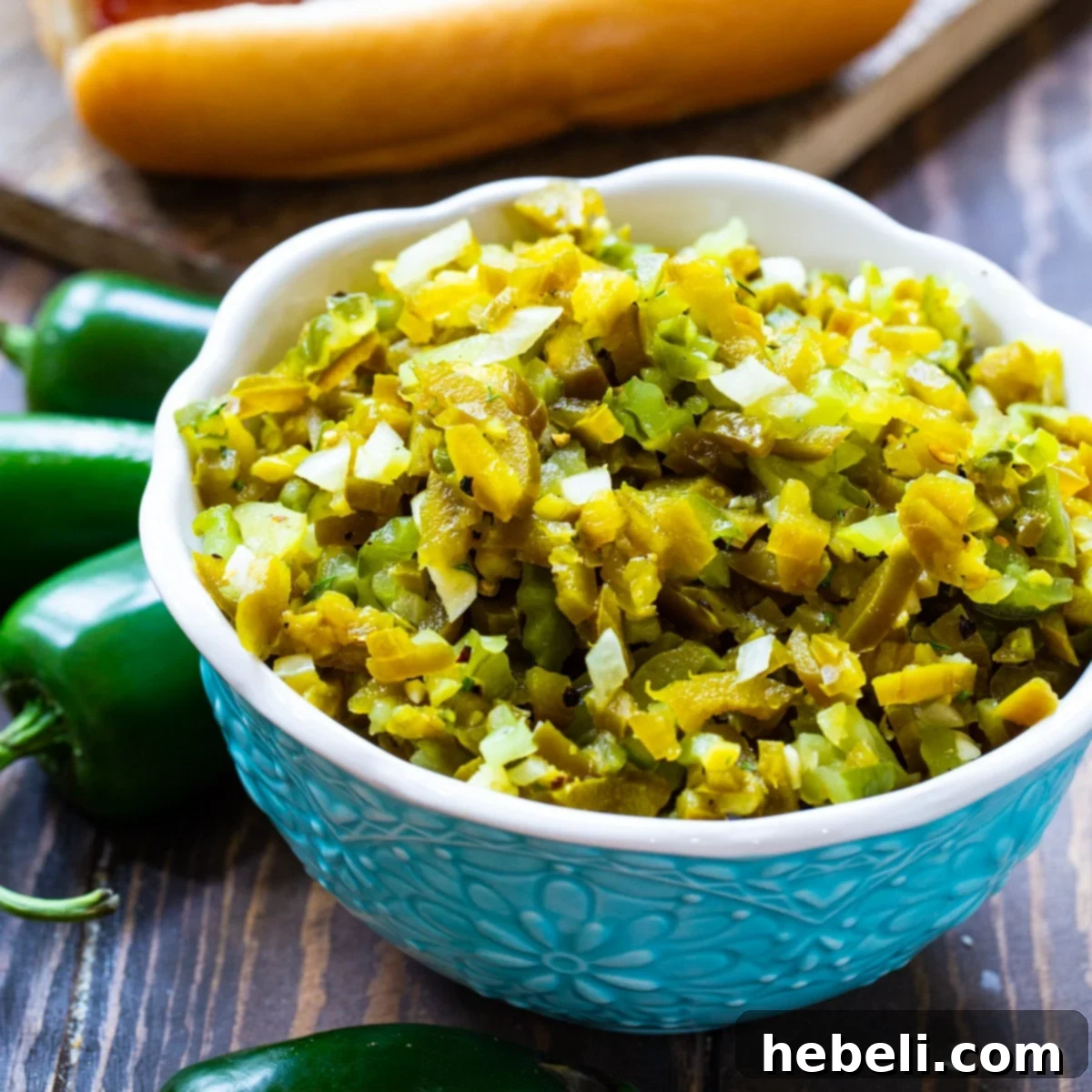 Freshly made Homemade Jalapeno Relish in a beautiful blue serving bowl, ready to be enjoyed as a vibrant topping.
