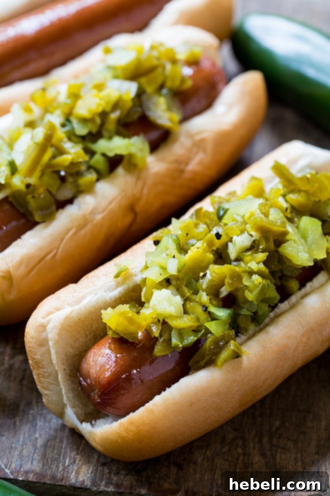 Homemade Jalapeno Relish makes a great topping for hot dogs, adding a delicious spicy kick and tangy flavor.