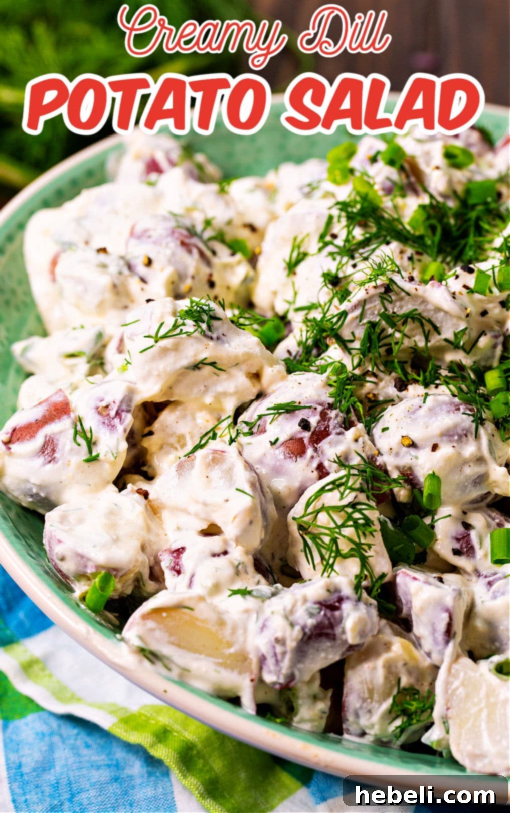 Creamy Dill Potato Salad 5 Creamy Dill Potato Salad served in a rustic bowl with a spoon, ready to be enjoyed.