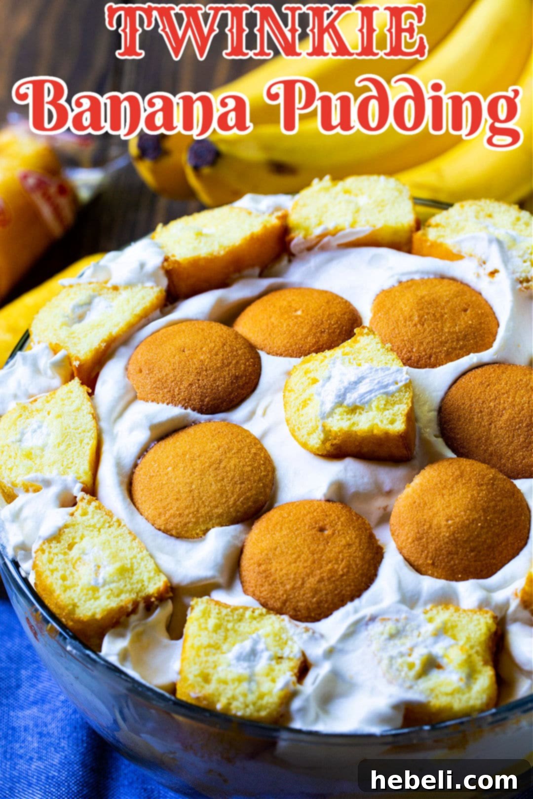 A close-up of Twinkie Banana Pudding in a glass bowl, highlighting the creamy layers and perfectly arranged Twinkie slices.