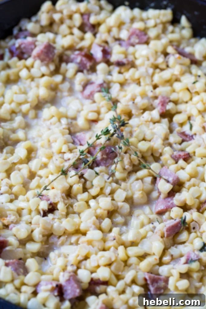 Ingredients for Creamed Corn with Smoked Sausage laid out on a kitchen counter