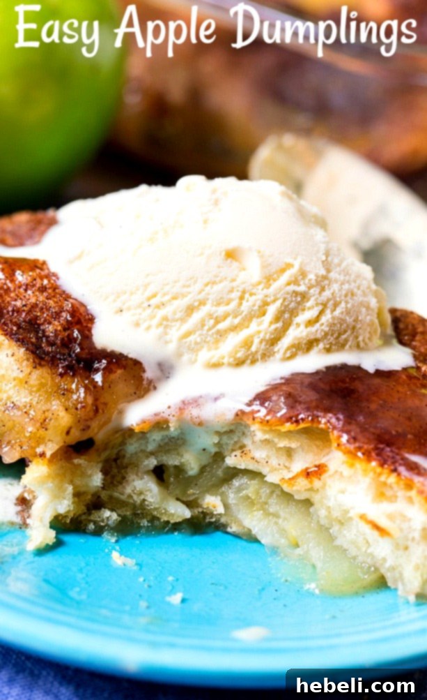 Effortless Apple Dumplings 7 Dumpling with a bite cut out, showing the tender apple inside.