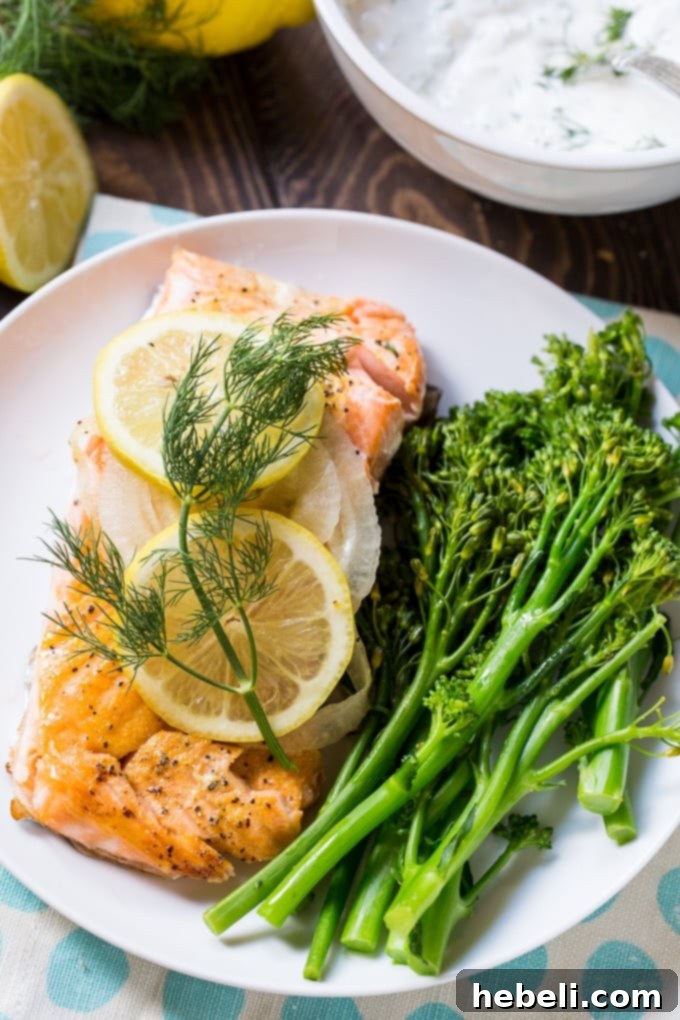 Salmon fillets baked in foil with onion and lemon slices