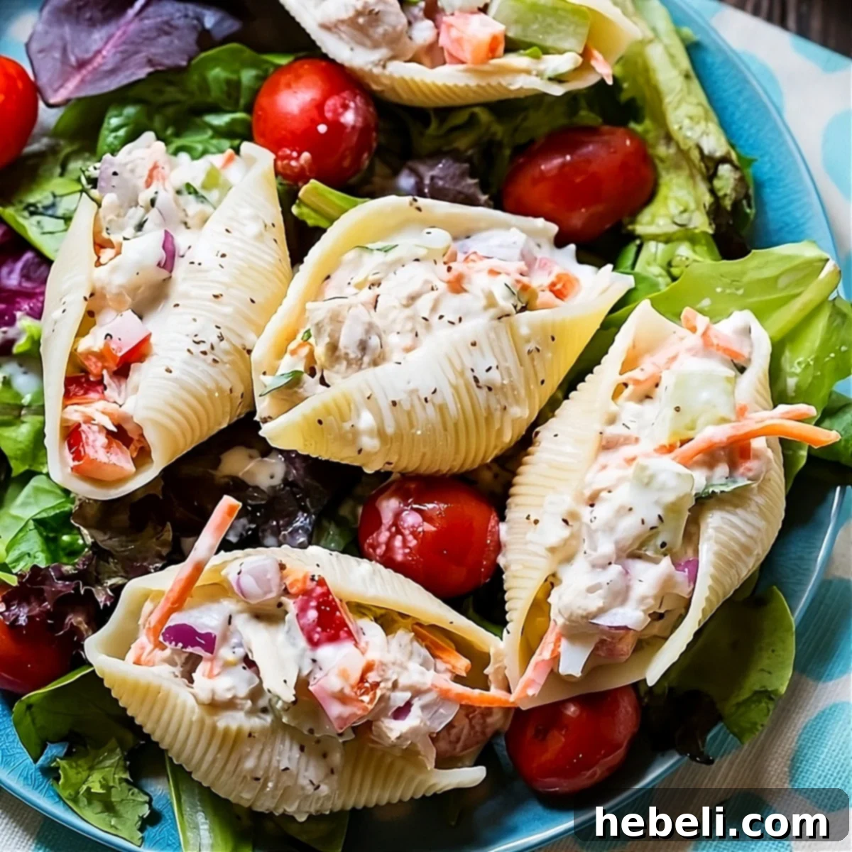 Tuna Salad Stuffed Jumbo Shells on a bed of lettuce.