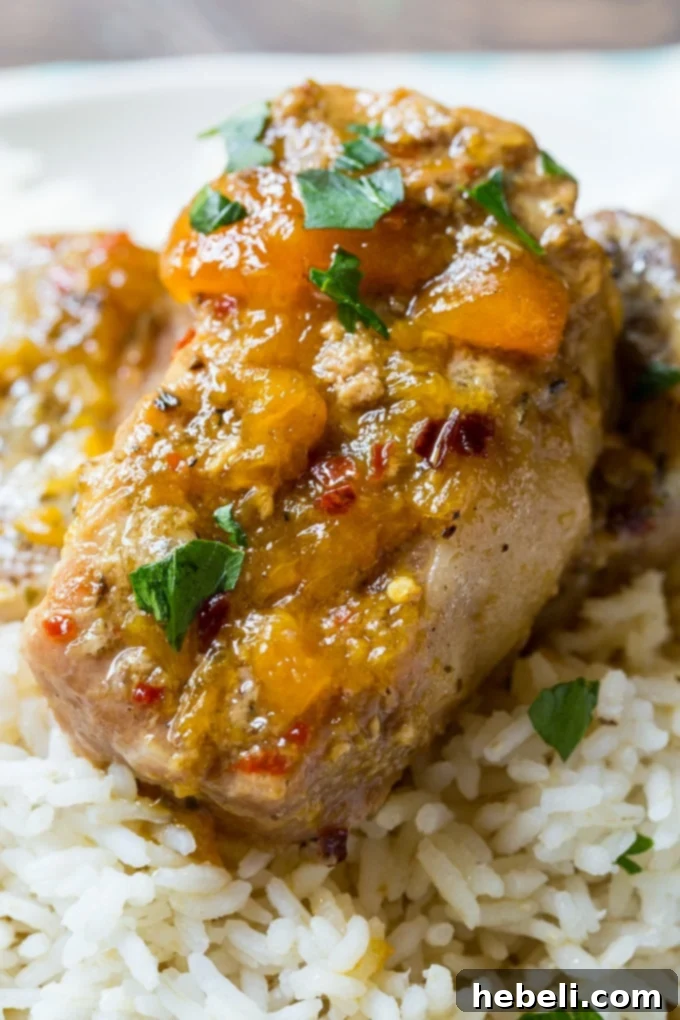 Pork chops with spicy peach glaze cooked in the crockpot, ready for serving.