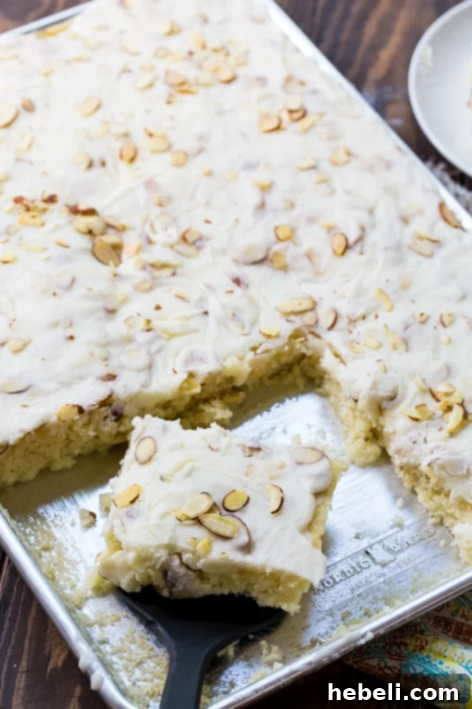 White Texas Sheet Cake recipe, showcasing its beautiful texture and creamy icing.