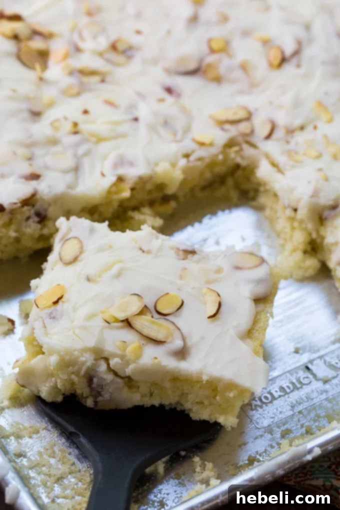 White Texas Sheet Cake with its signature almond flavoring and glossy icing.