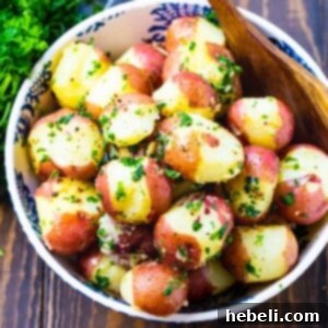 Buttered Parslied Potatoes in a serving bowl.