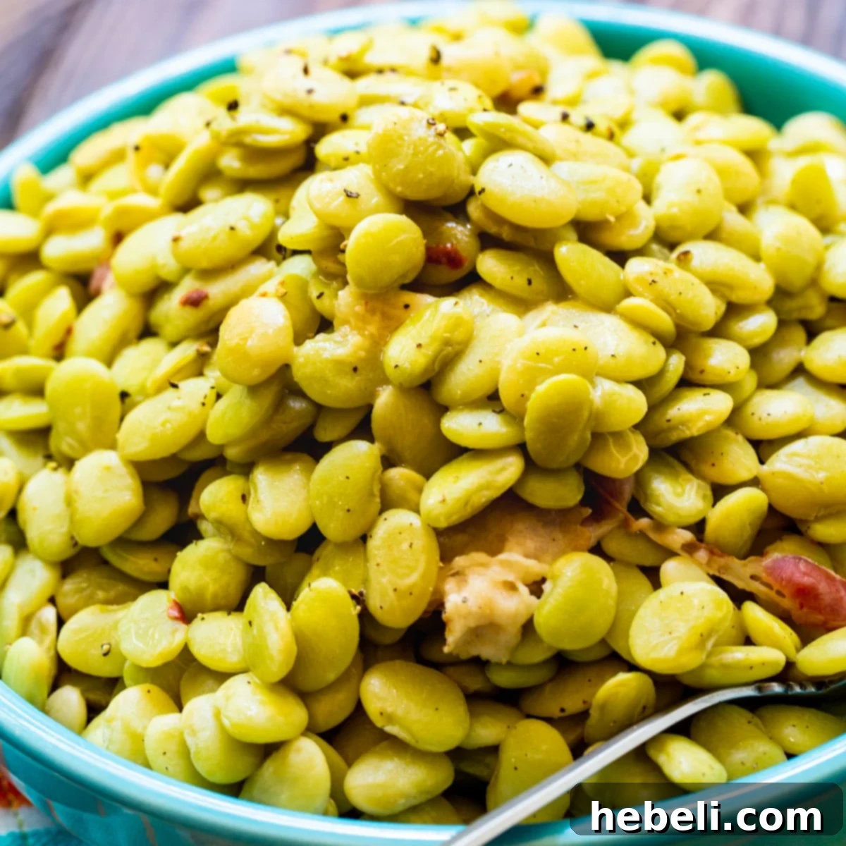 Cracker Barrel Homestyle Baby Limas 2 Cracker Barrel Lima Beans served in a rustic blue bowl, garnished with fresh parsley.