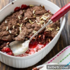 Final plated image of Chocolate Cherry Cobbler with ice cream