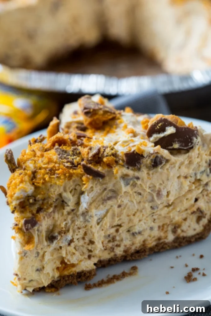A stunning Butterfinger Pie, prominently featuring its peanut butter and Butterfinger elements.