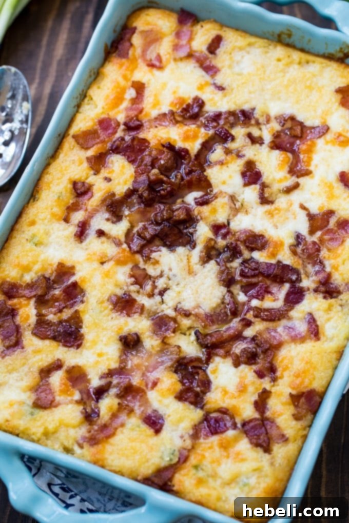 Savory Cheesy Bacon Grits Bake 4 A large pan of Cheese Grits Casserole with Bacon, freshly baked and golden brown.