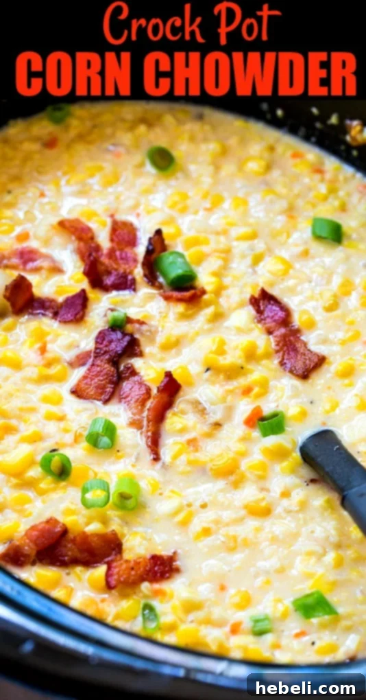 Close up of creamy corn chowder topped with bacon in a black slow cooker.