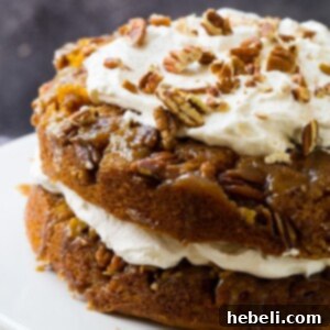 Pumpkin Praline Torte on a white cake stand.