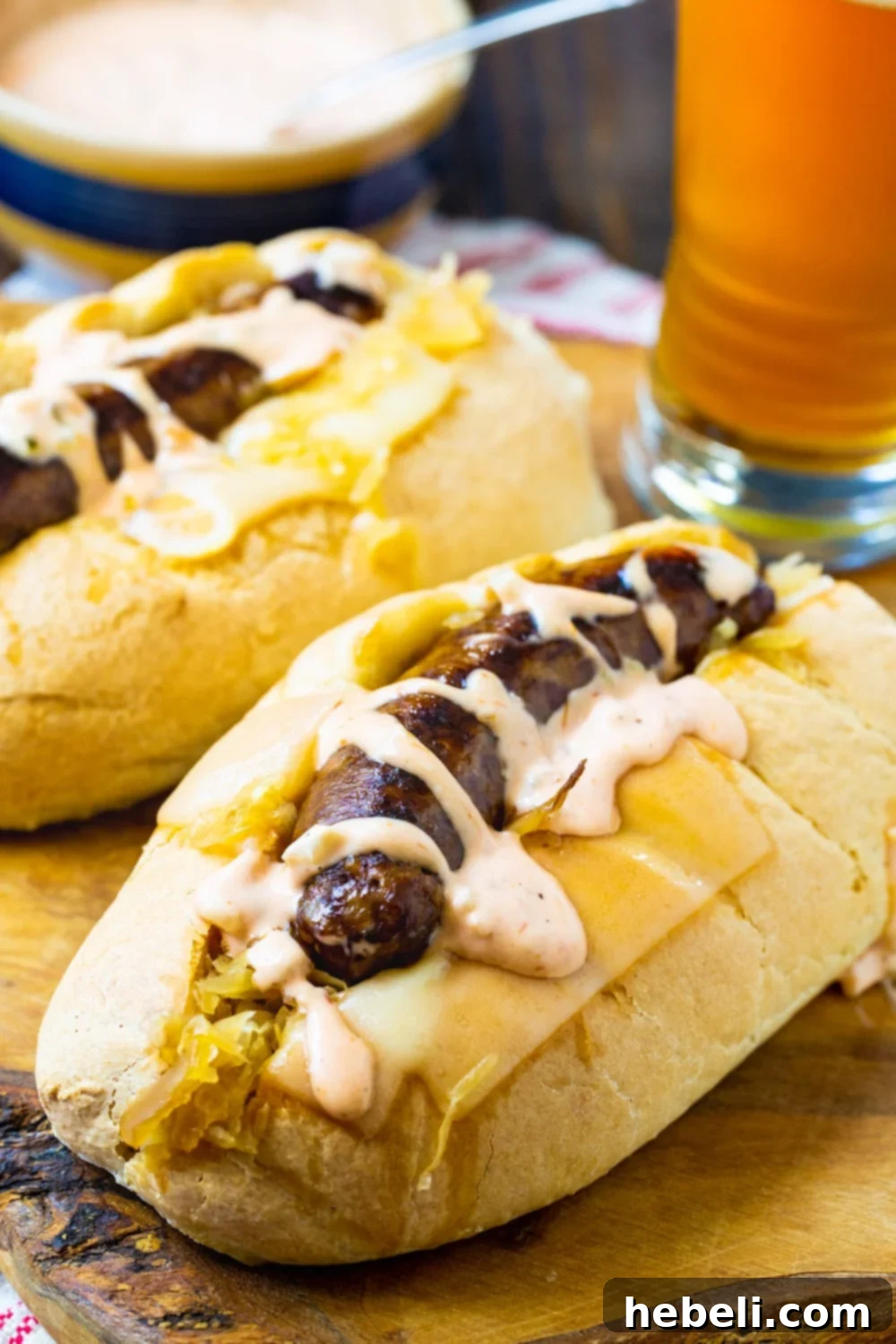 Easy Slow Cooker Reuben Brats 4 Three prepared Crock Pot Reuben Brats served on a cutting board, garnished with fresh herbs, showcasing the rich filling and dressing.