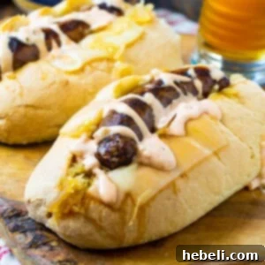 Two Crockpot Reuben Brats in buns, small thumbnail image.