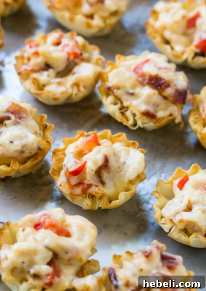 Close-up of freshly baked Mini Hot Brown Tarts, ready to serve.