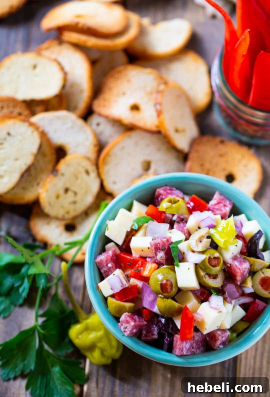 Overhead of dip in a small bowl surrounded by bagel chips.