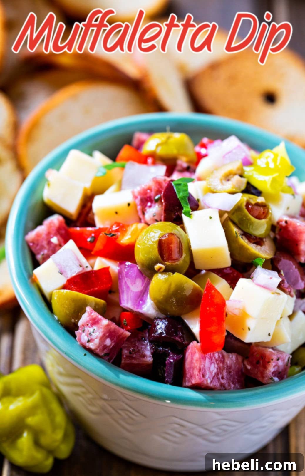 Close-up of Muffaletta Dip in a serving bowl.