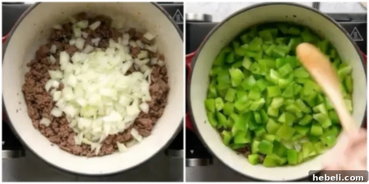 Diced onion and bell pepper added to the browned ground beef in a Dutch oven.