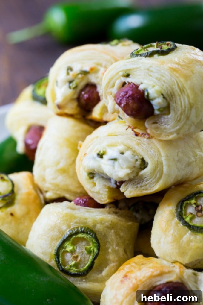 Spicy Piggy Poppers 6 A serving platter filled with freshly baked Jalapeno Popper Pigs in a Blanket, perfect for sharing.