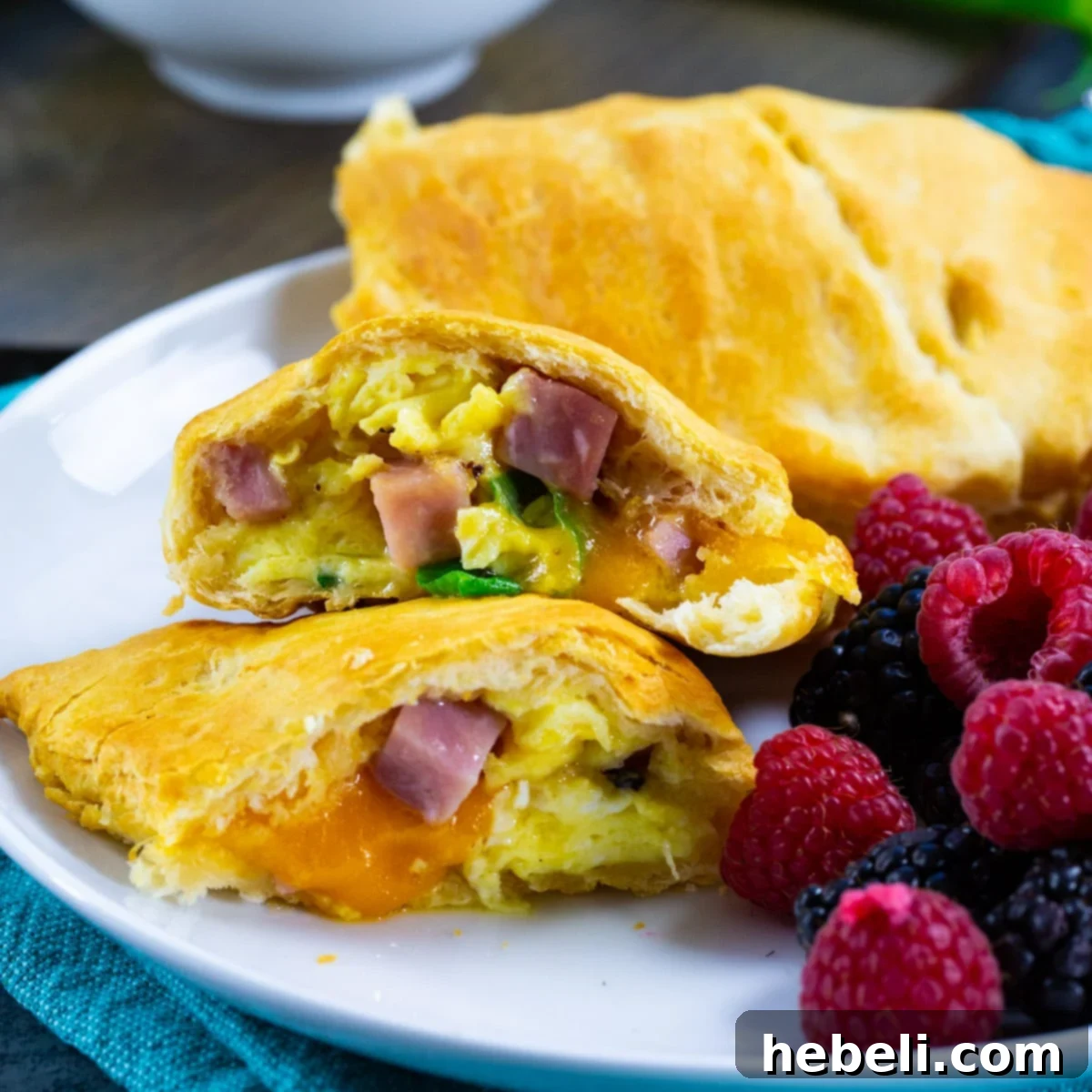 11 Brilliant Ways to Use Leftover Ham 3 Air Fryer Ham and Egg Pockets, breakfast pastries filled with egg, ham, and cheese in crescent dough.
