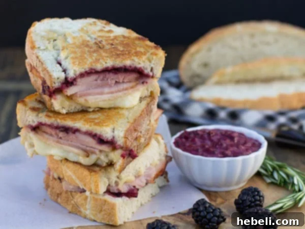 11 Brilliant Ways to Use Leftover Ham 10 Ham Panini halves stacked on top of each other with a small bowl of Blackberry Mustard, a wonderful twist on a traditional ham and cheese sandwich.