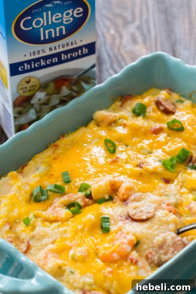 Close-up of a cheesy Shrimp and Grits Casserole, showcasing its melted cheddar and rich texture