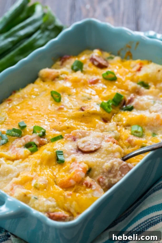 A delectable serving of Cheesy Shrimp and Grits Casserole, golden and ready to be enjoyed