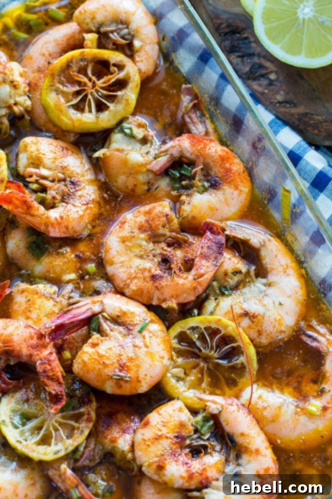 New Orleans Style BBQ Shrimp in a pan with French bread for dipping, ready to be served