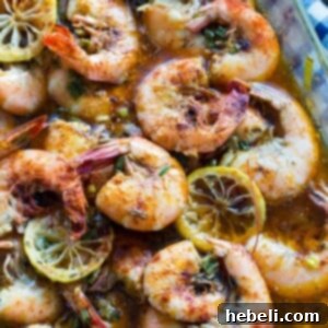 New Orleans Style BBQ Shrimp in a white bowl, ready to be served