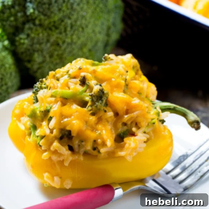 Cheesy Broccoli Pepper Boats 2 Delicious Broccoli and Cheese Stuffed Peppers on a serving platter