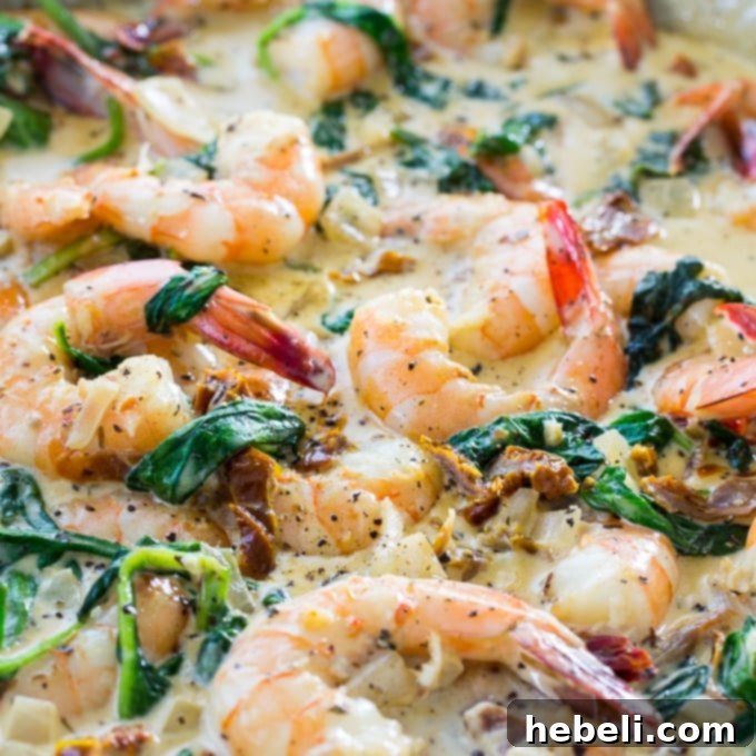 Shrimp in Tuscan Cream Sauce 2 Creamy Tuscan Shrimp, an ultimate seafood dish featuring a rich Parmesan sauce, vibrant spinach, and sun-dried tomatoes.