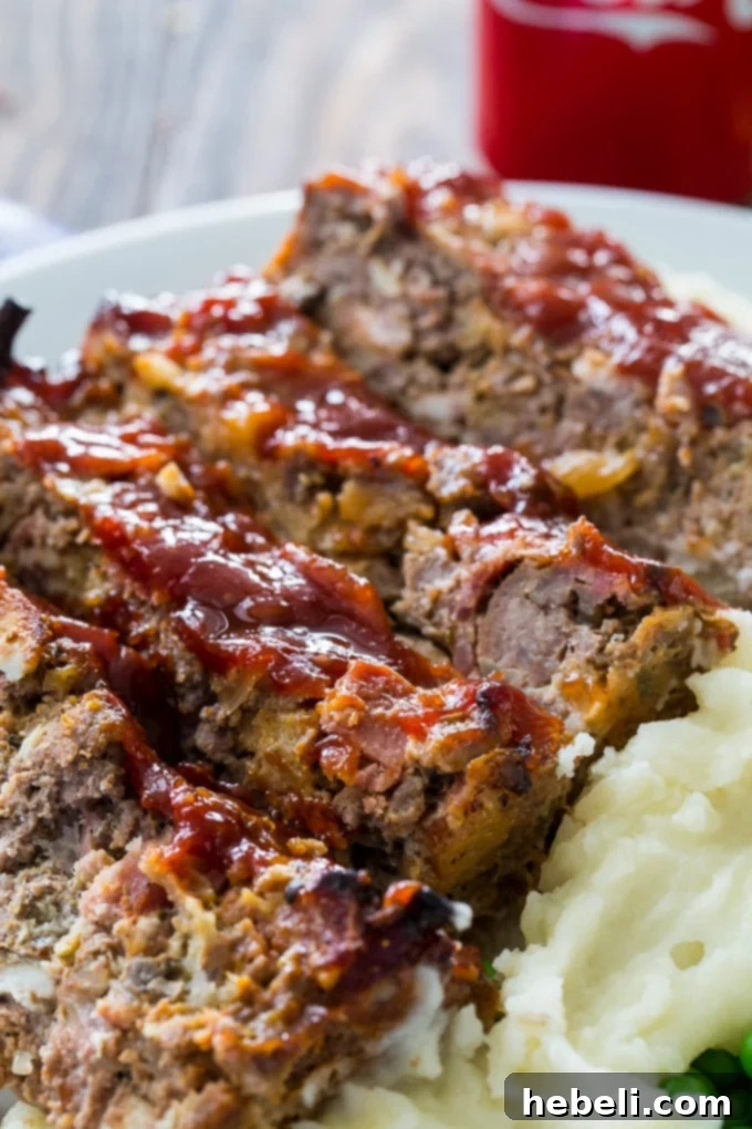 Cola-Glazed Bourbon Meatloaf 4 Slice of Bourbon and Coke Meatloaf with glaze and sides