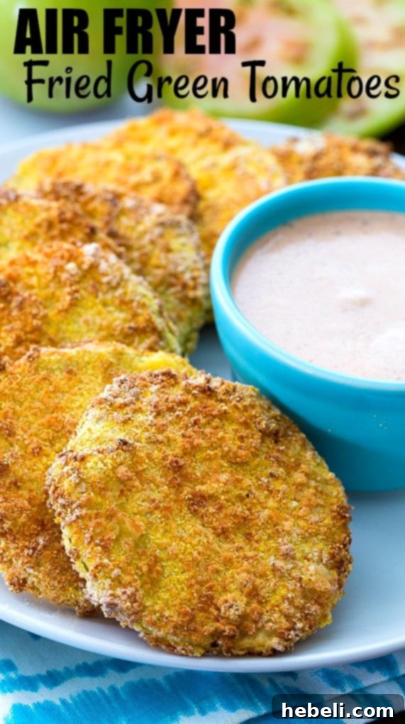 Plate of Air Fryer Fried Green Tomatoes with dipping sauce, low fat and perfectly golden.