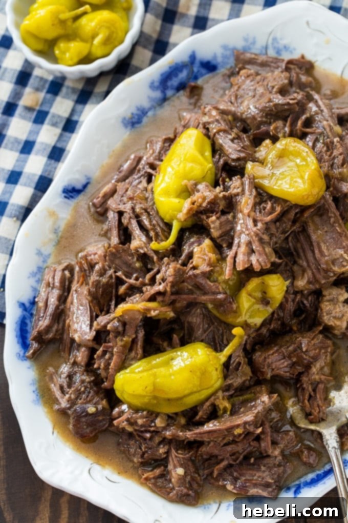 Mississippi Pot Roast: Instant Pot Edition 6 Large platter of Instant Pot Mississippi Roast with serving utensils