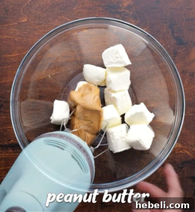 Easy No-Bake Peanut Butter Cup Pie 4 Beating peanut butter and cream cheese until smooth in a bowl.
