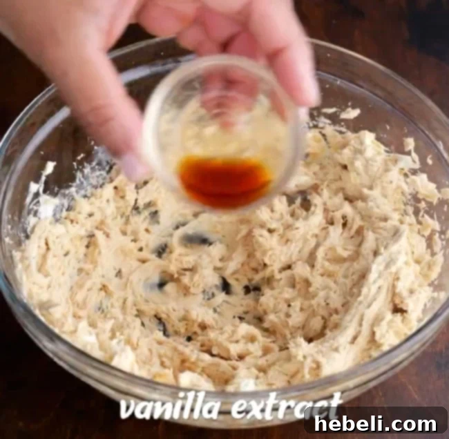 Easy No-Bake Peanut Butter Cup Pie 5 Adding vanilla extract to the mixture.