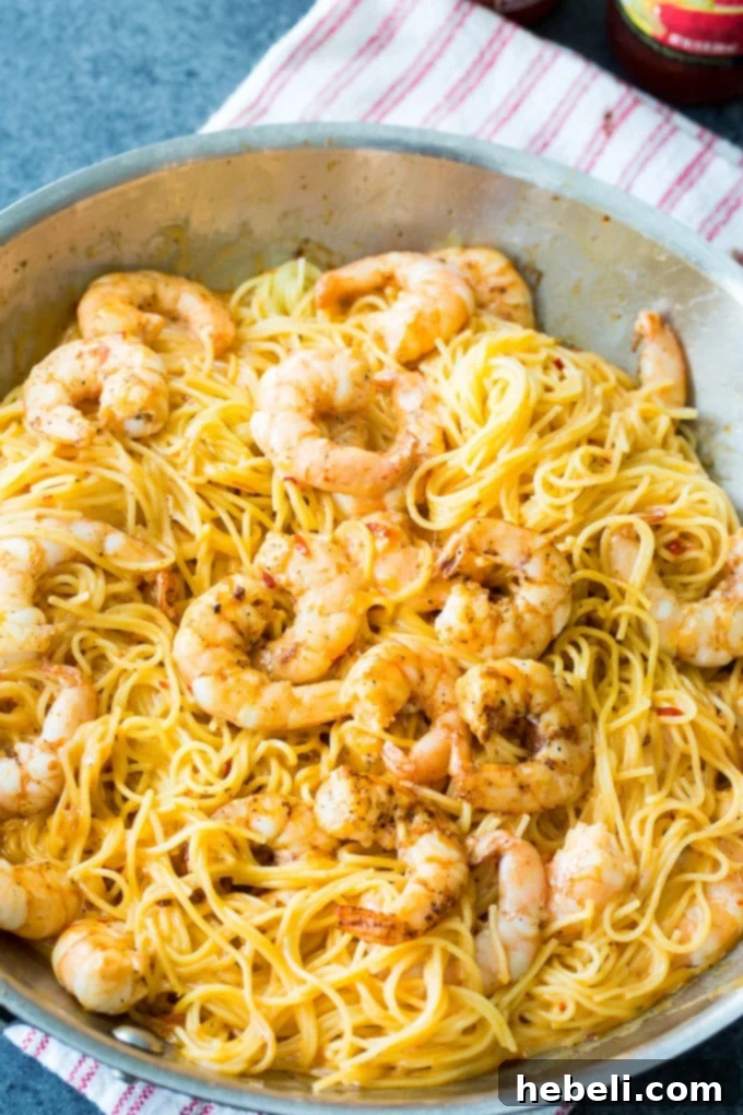 Ingredients for Bang Bang Shrimp Pasta recipe including shrimp, pasta, and sauce components