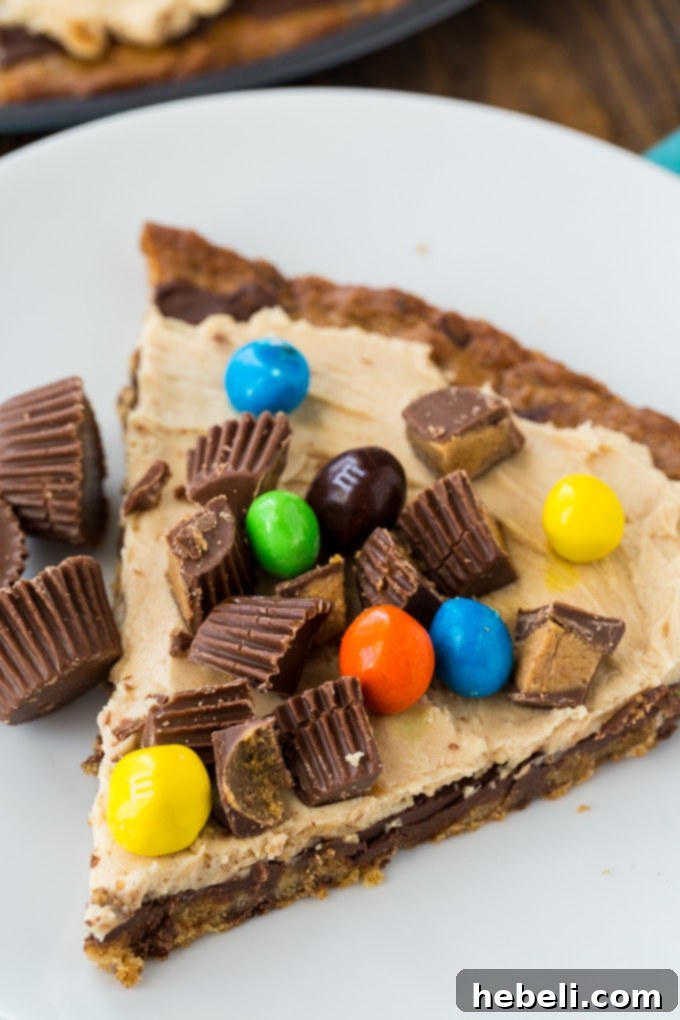 Decadent Peanut Butter Cup Pizza 6 The full Peanut Butter Cup Dessert Pizza, showcasing its generous toppings.
