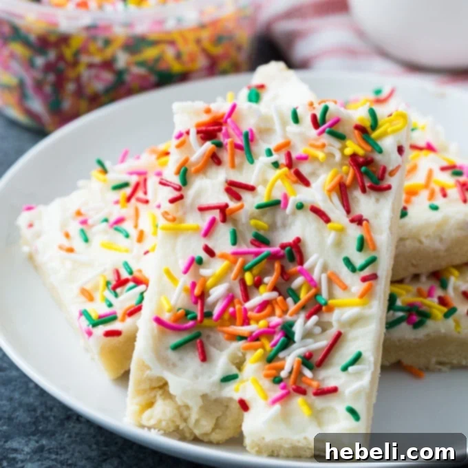 Soft and chewy Sugar Cookie Bars topped with colorful sprinkles