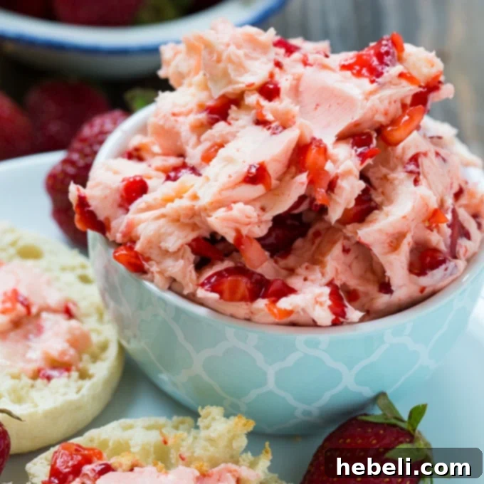 Fresh Strawberry Butter spread on a biscuit