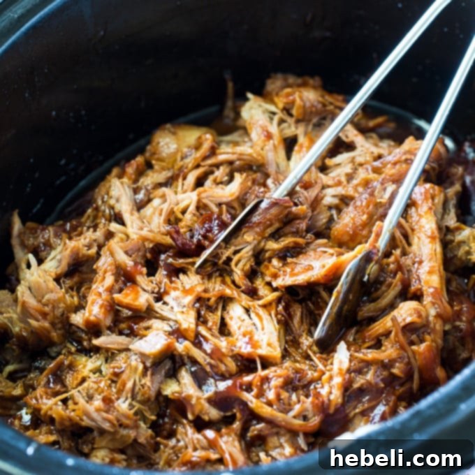 Root Beer Infused Pulled Pork 2 Crock Pot Root Beer Pulled Pork ready to be served with coleslaw