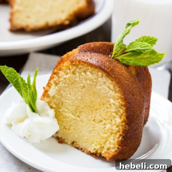 Decadent Amaretto Bake 2 Decadent Amaretto Pound Cake, a moist and buttery dessert garnished with fresh berries and whipped cream