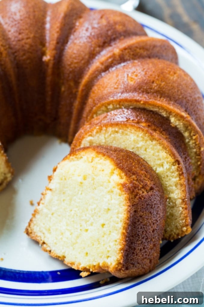 Decadent Amaretto Bake 3 Beautifully sliced Amaretto Pound Cake revealing its tender and moist texture