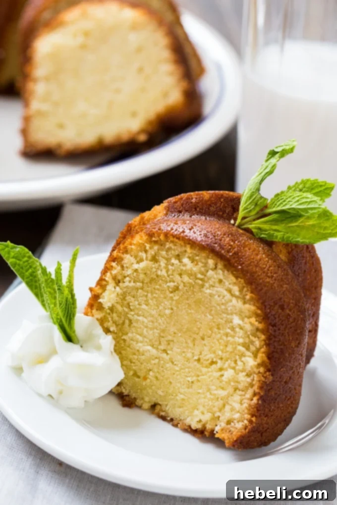 Decadent Amaretto Bake 4 Close-up of a perfectly baked slice of Amaretto Pound Cake, showcasing its moist texture and golden crust