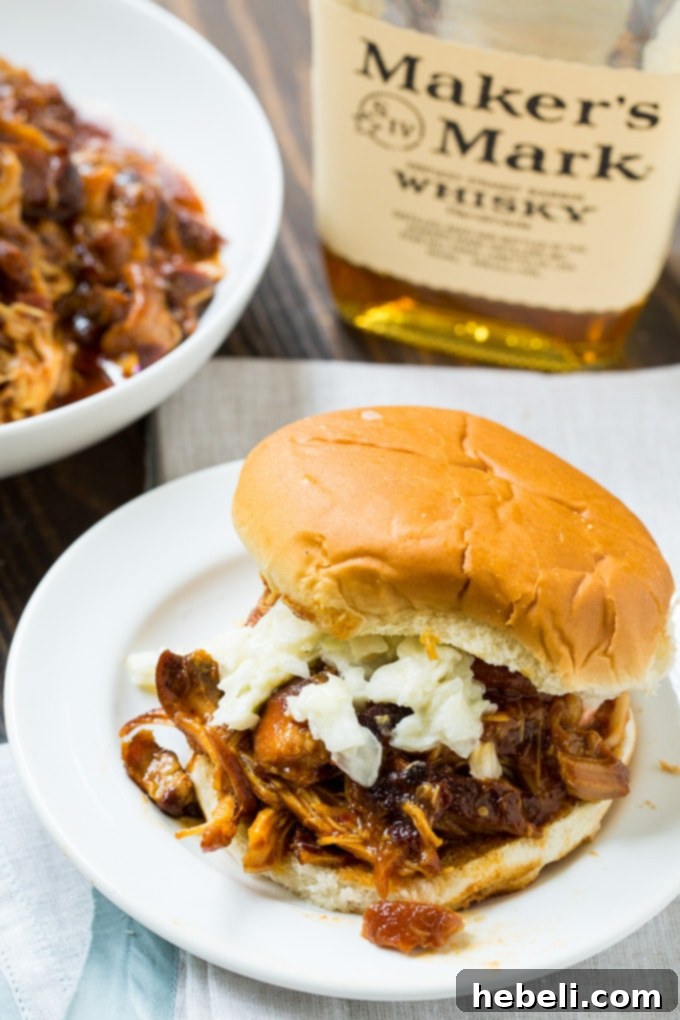 Smoky Bourbon Bacon Slow Cooker Pulled Chicken 4 Close-up of shredded Crock Pot Bourbon Bacon Pulled Chicken in slow cooker